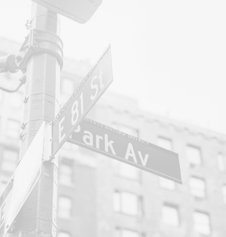 Park Avenue street sign in foggy New York City with buildings in background